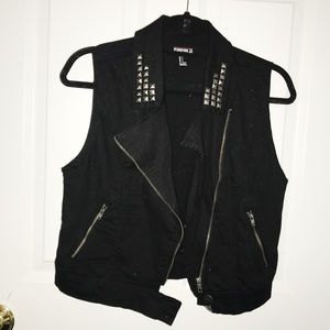 Black studded vest.